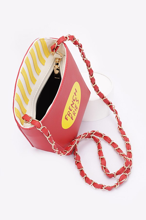 Red bag shaped like a French fry with a chain strap on a white background